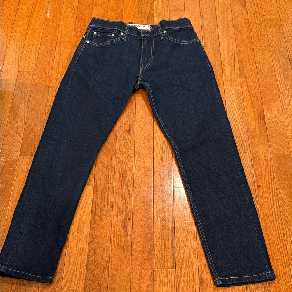 Levi's 511 Slim Fit model in a dark blue wash
